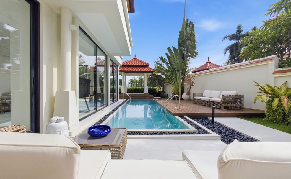 Poolside loungers and Thai sala framing the private swimming pool