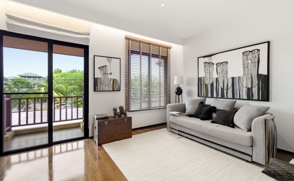 Upstairs lounge with balcony access and relaxed seating area