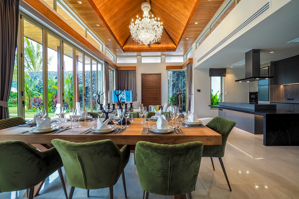Dining room with garden views and adjoining modern kitchen