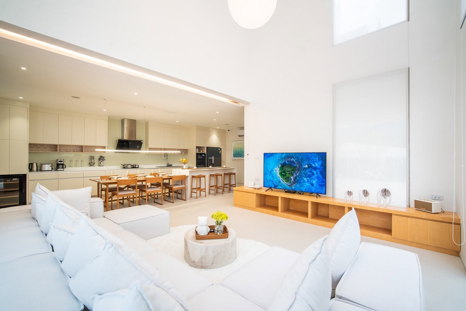 Open-plan living and kitchen with double-height ceiling