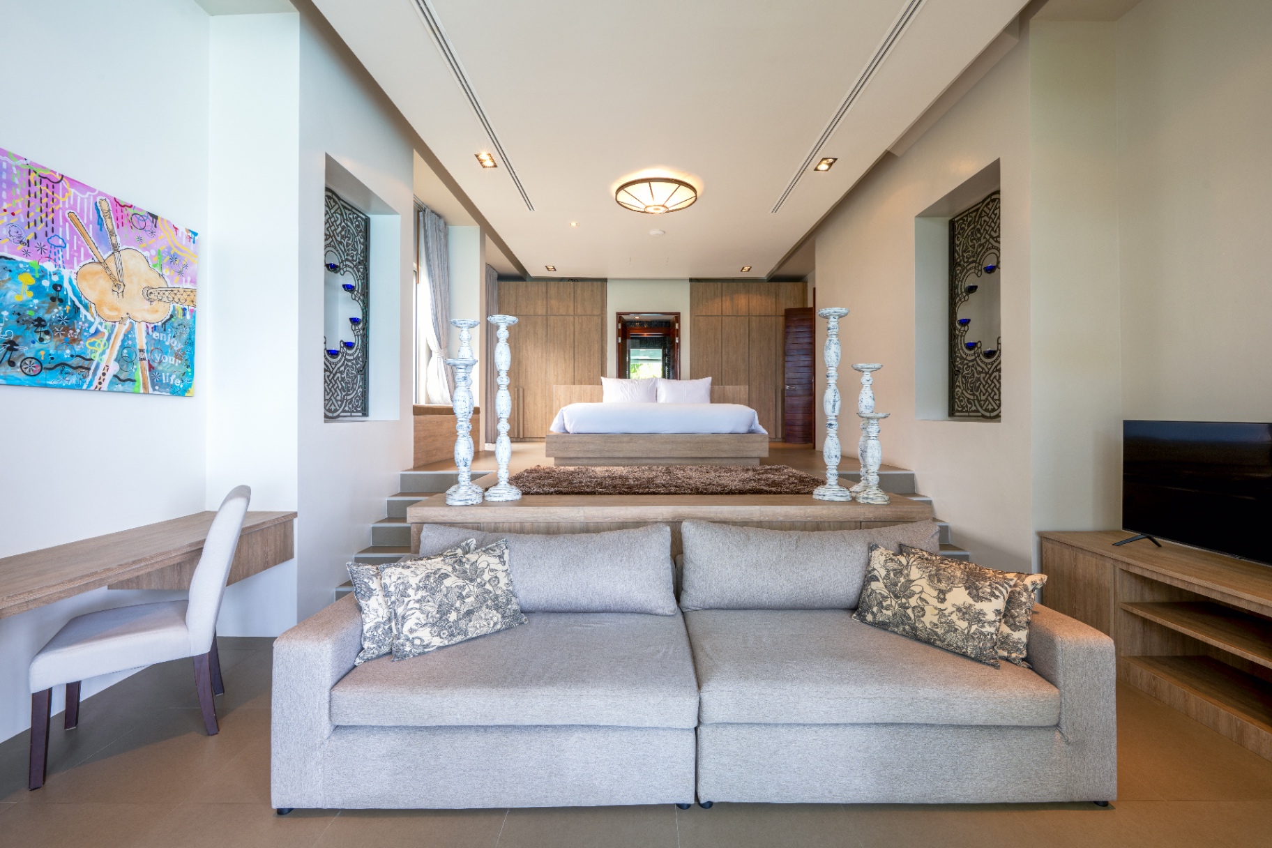 Bedroom suite with private lounge area