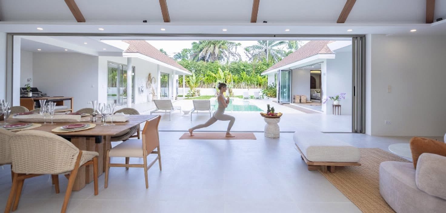 Open-plan living and dining opening to the pool