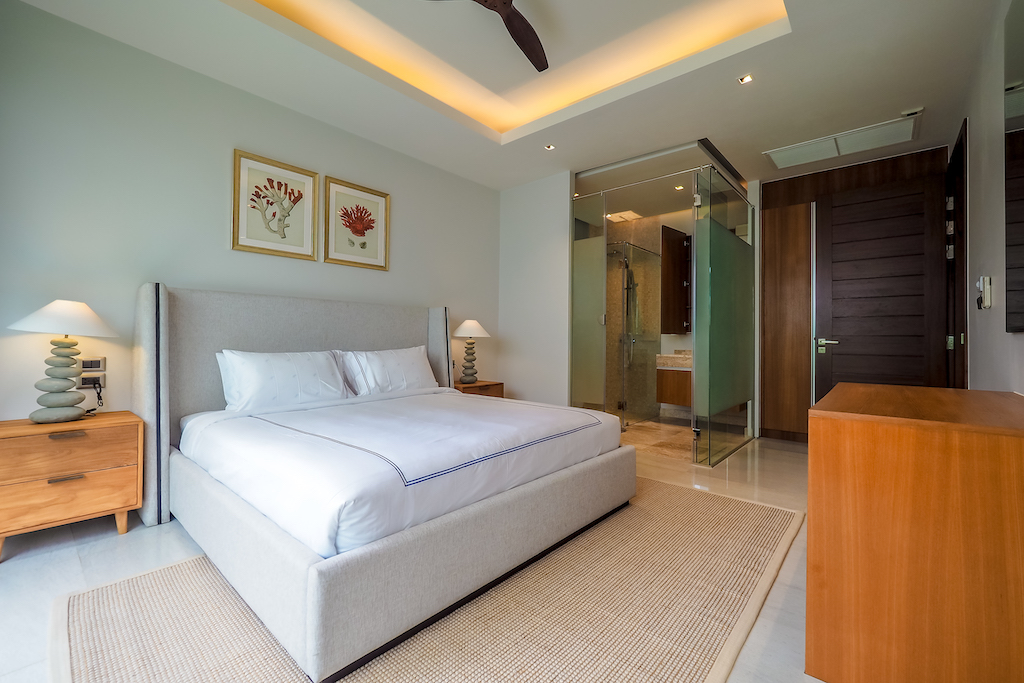 Second bedroom with glass-enclosed en-suite bathroom