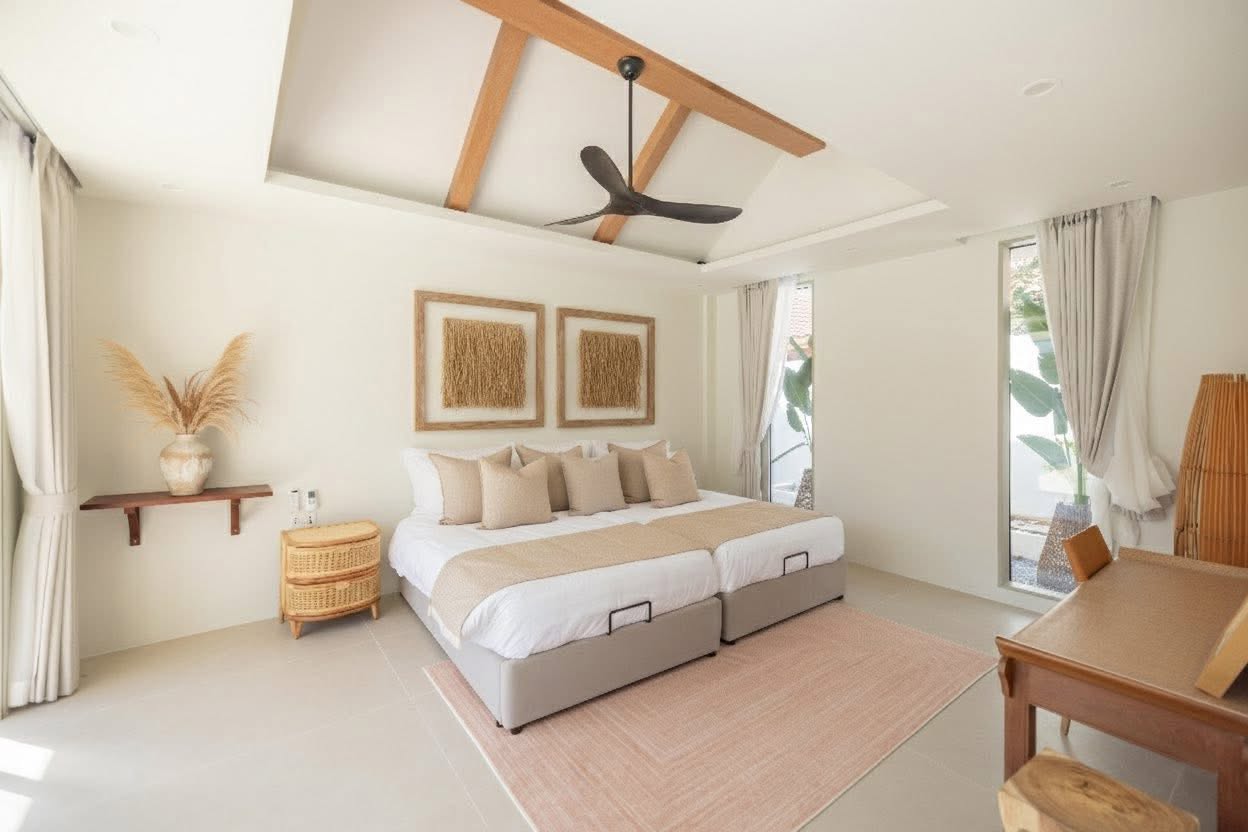 Twin bedroom with vaulted ceiling and garden view