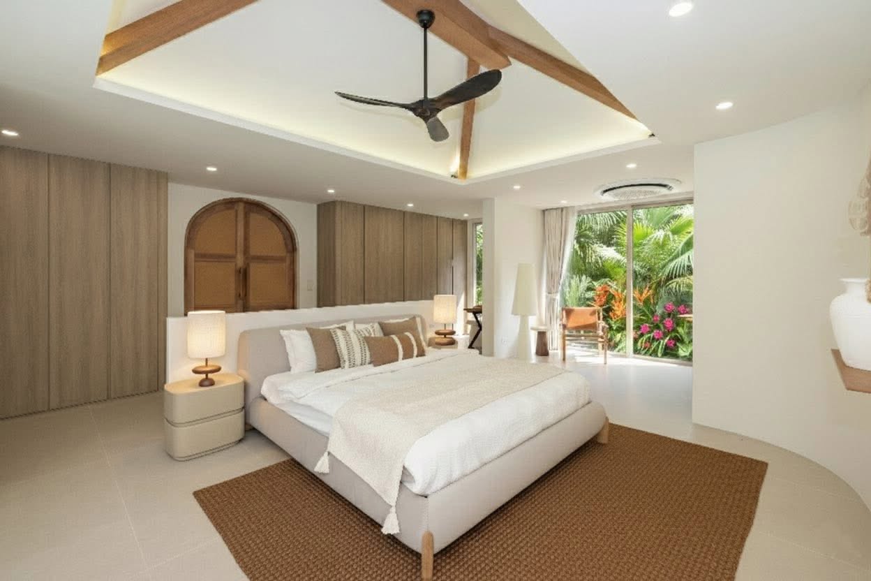 Master bedroom suite with arched timber wardrobe and garden view