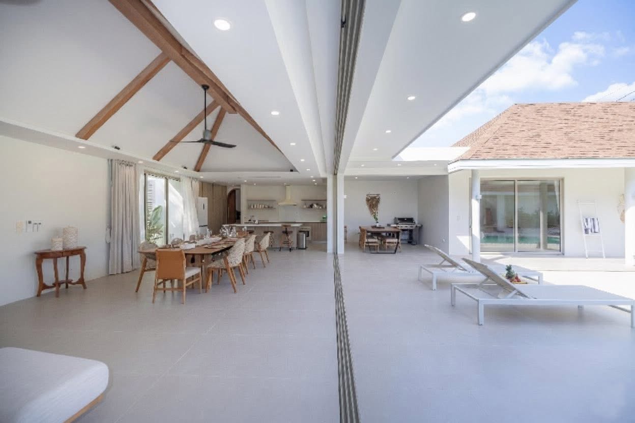 Covered terrace and open-plan dining opening onto the pool