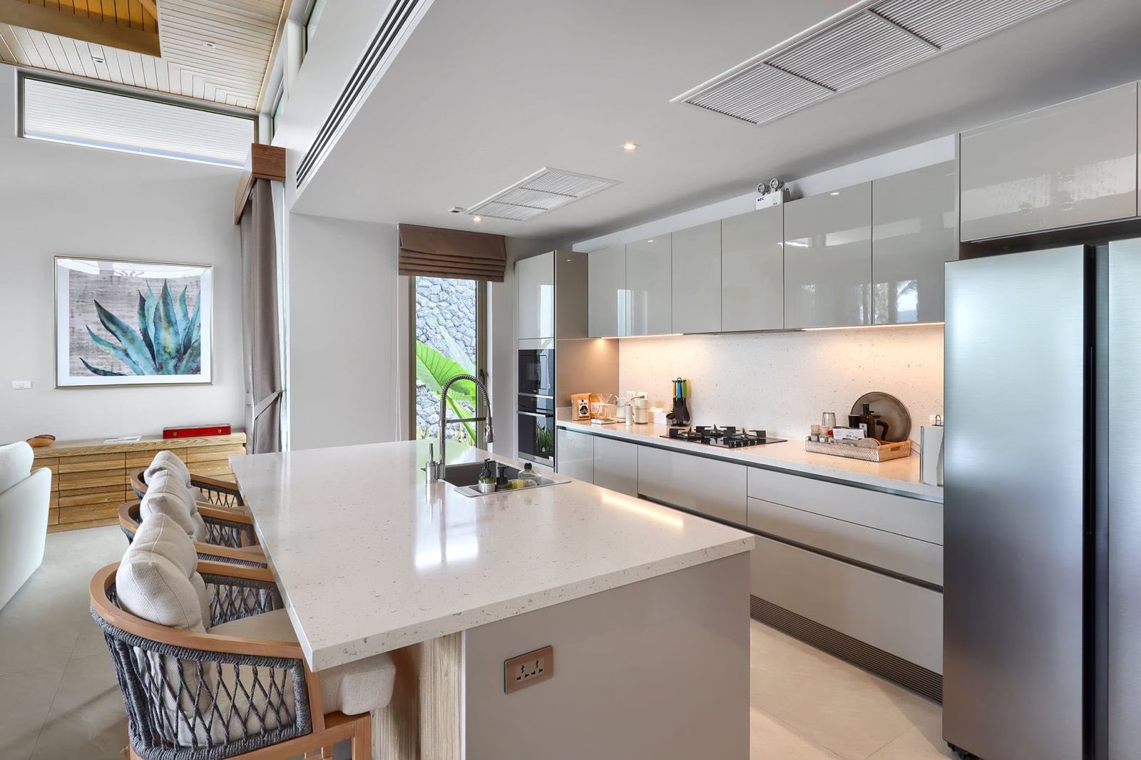 Modern kitchen with island, breakfast bar and high-gloss cabinetry