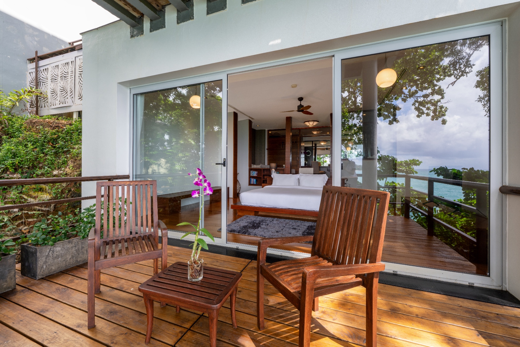 Bedroom with timber terrace deck and ocean views