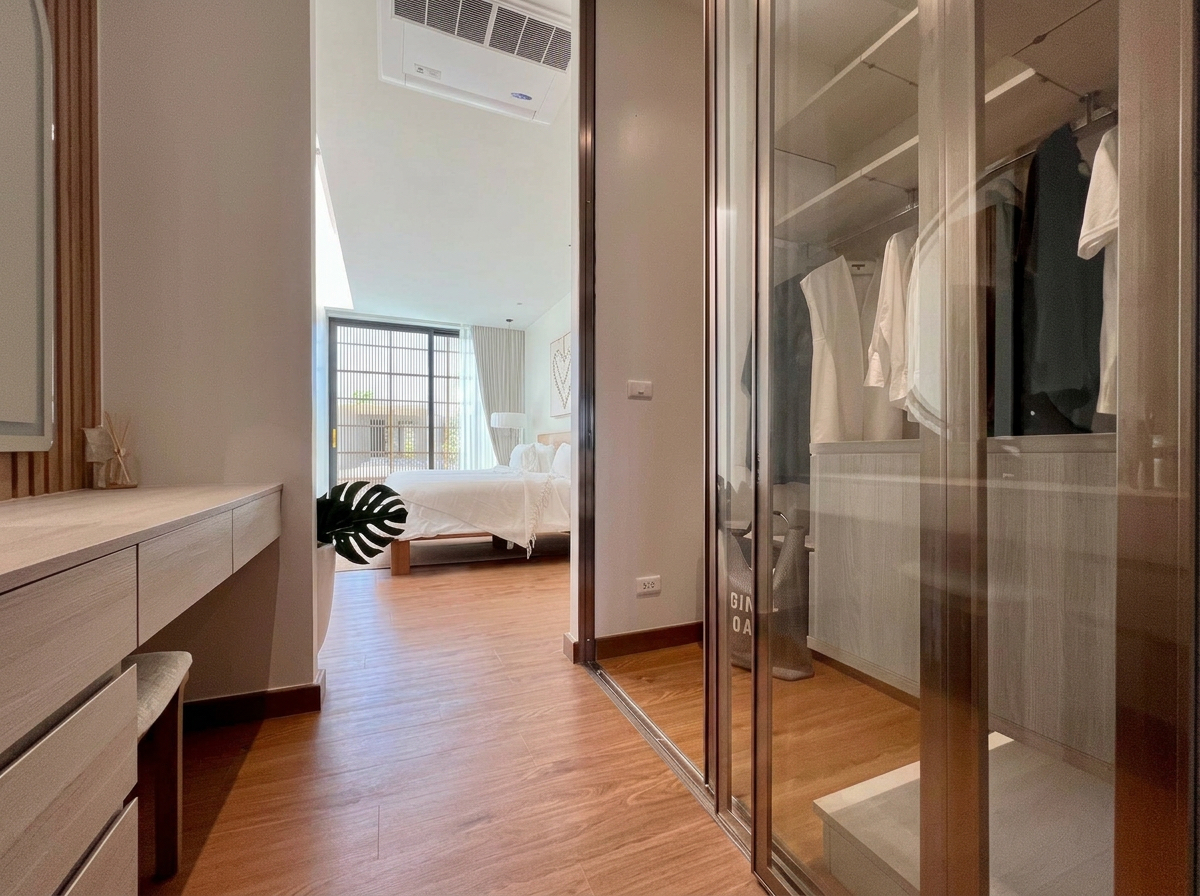 Bedroom suite view through the wardrobe area toward the sleeping space