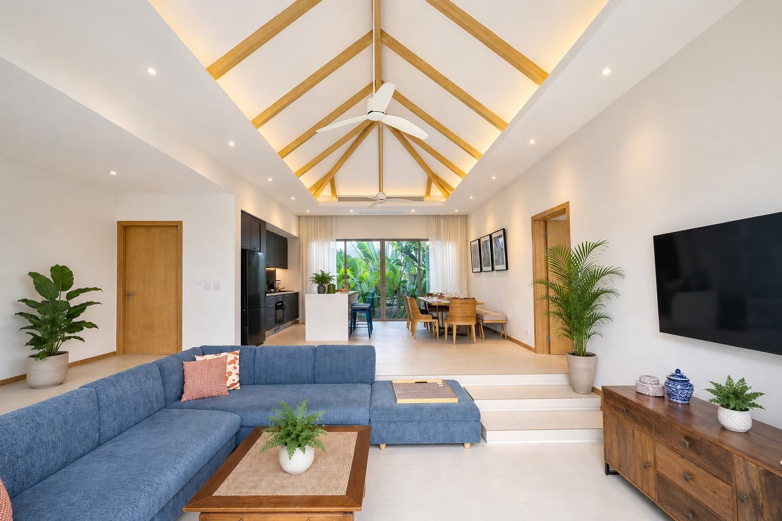 Living room with vaulted ceiling, TV and pool views