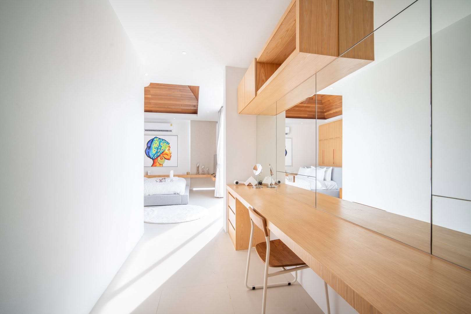 Dressing corridor with built-in vanity leading to the bedroom