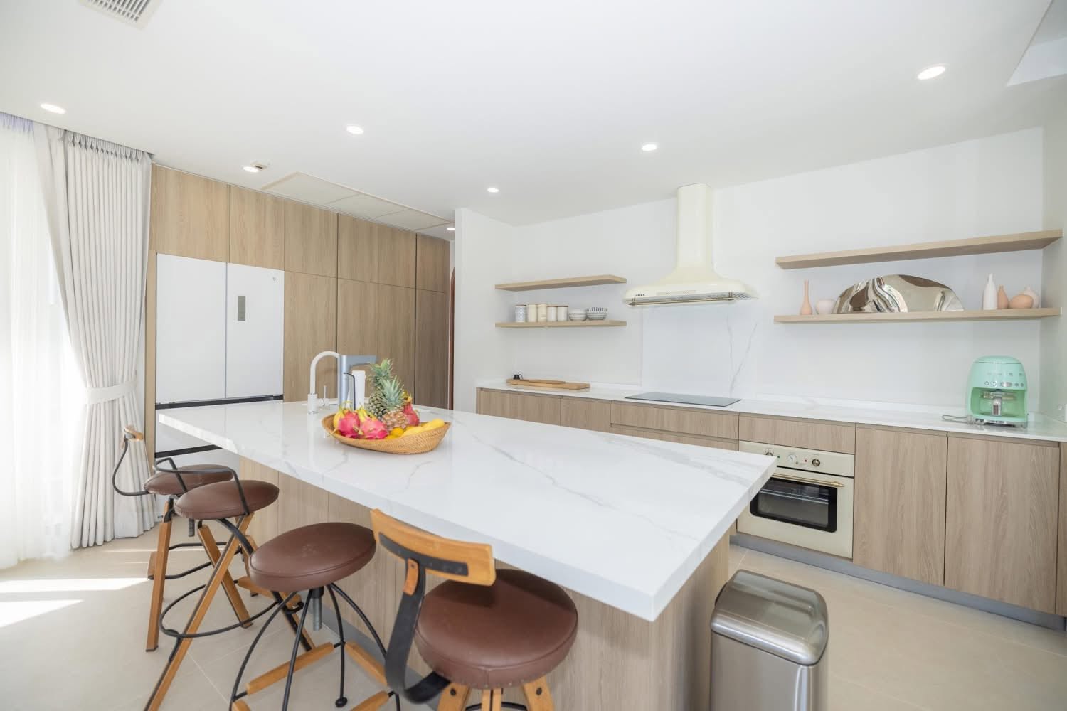 Western kitchen with large marble island and breakfast bar