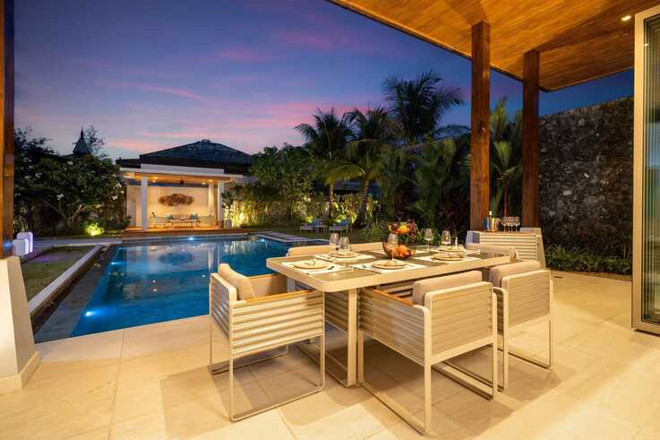 Covered outdoor dining area at sunset