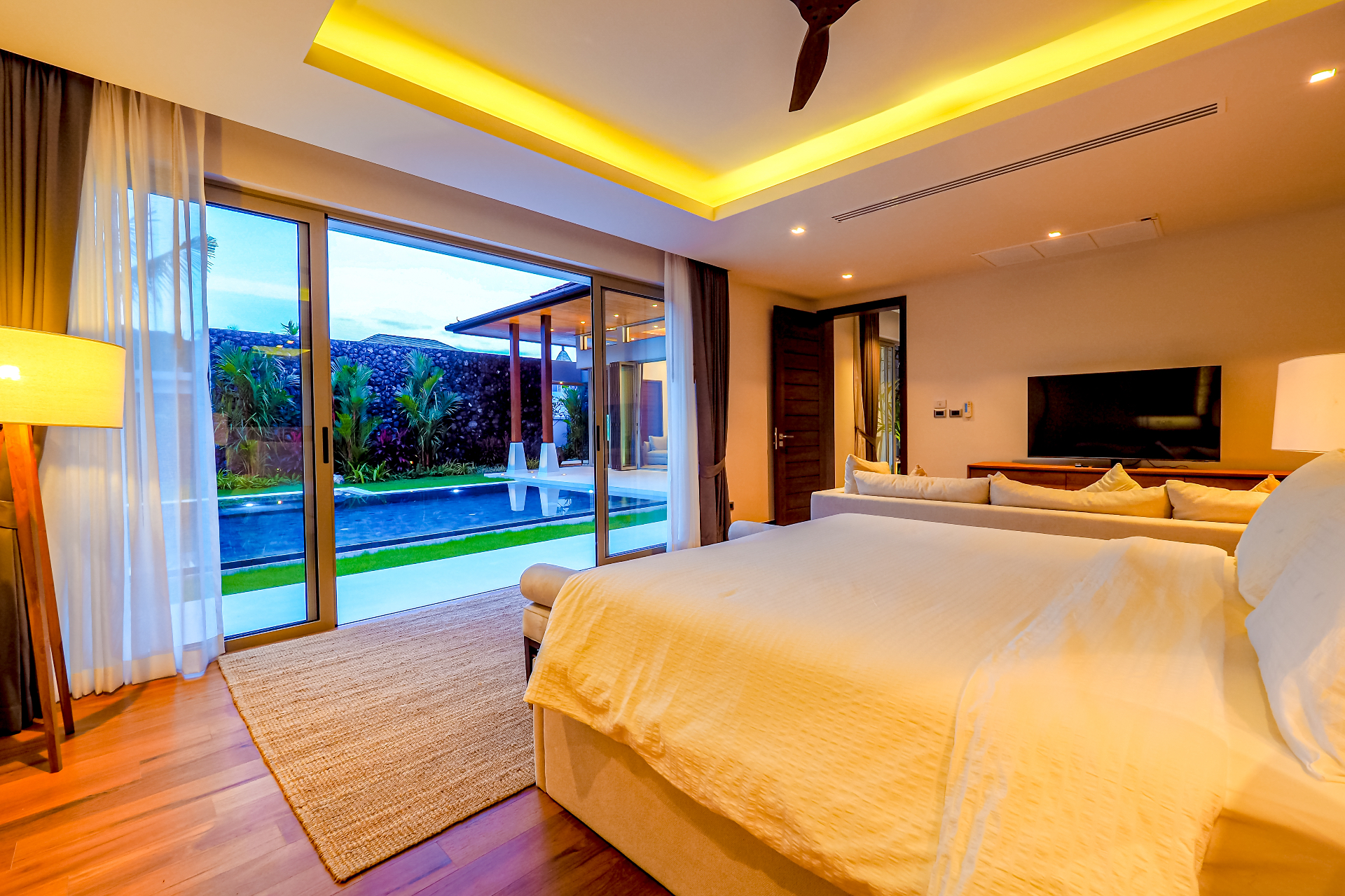 Master bedroom opening onto the private pool and garden