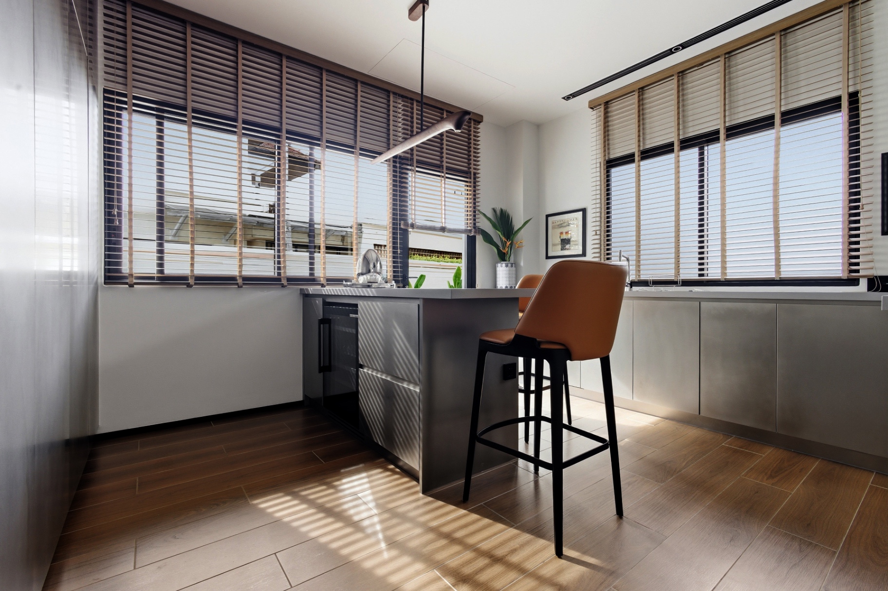Contemporary Bosch kitchen with island seating and full-height windows