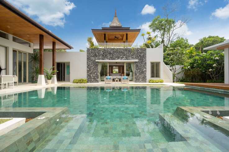 Pool with stone-clad pavilion and seating