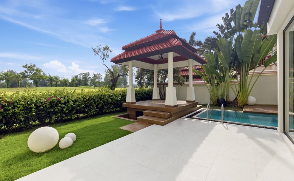 Thai sala and garden terrace beside the private pool and fairway hedge