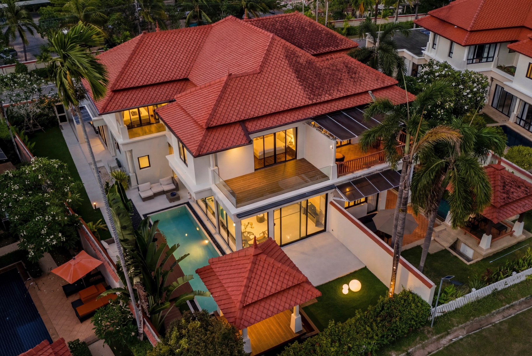 Aerial twilight view of Laguna Fairway Golf View Villa and pool courtyard
