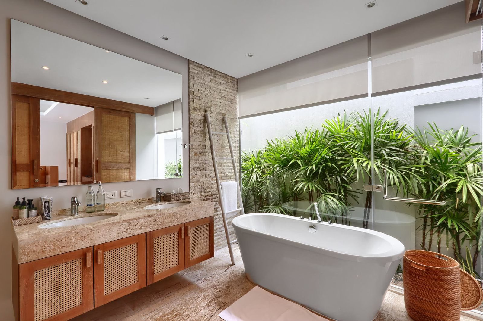 Master bathroom with freestanding tub, double vanity and garden outlook