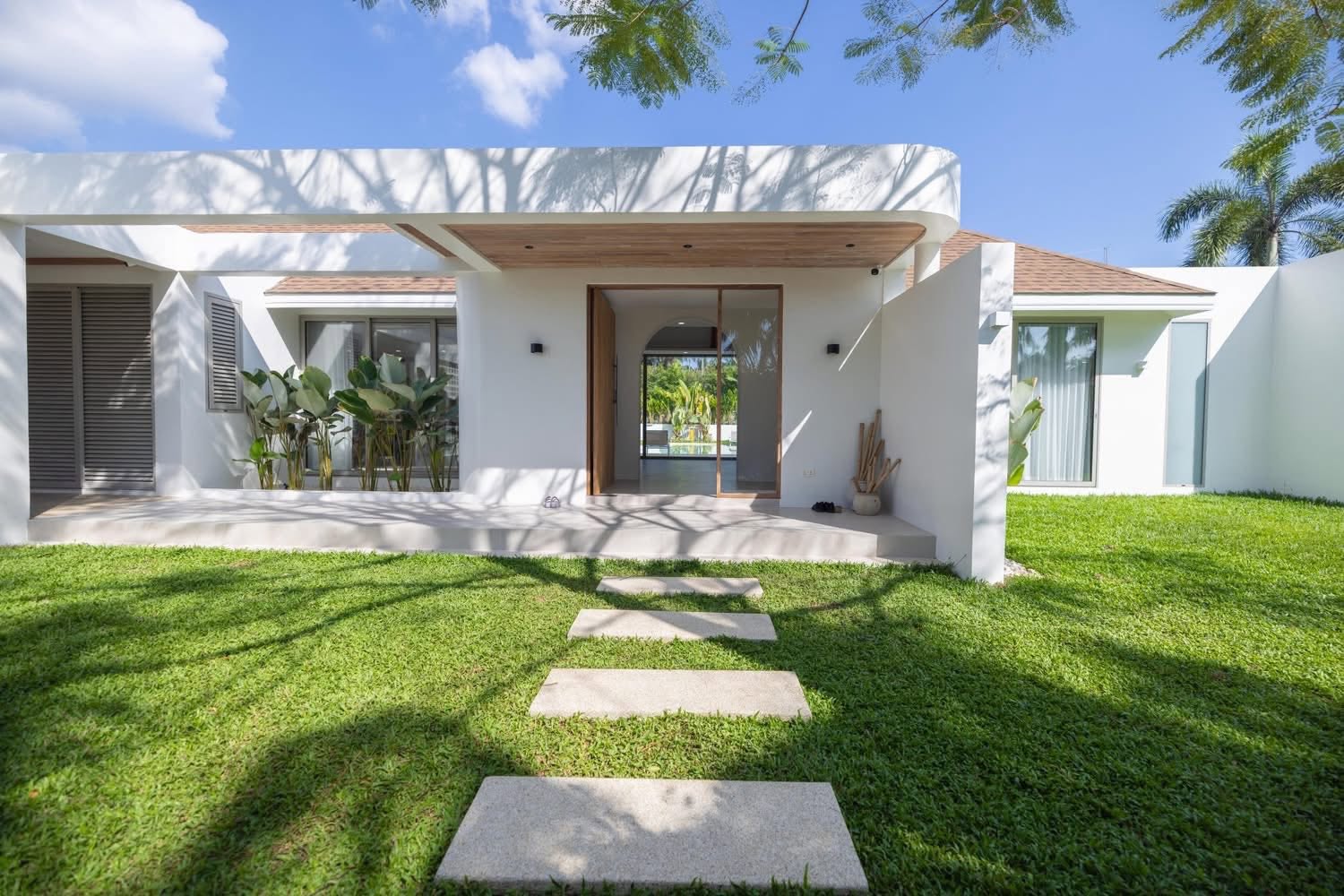 Villa entrance with garden stepping-stone pathway