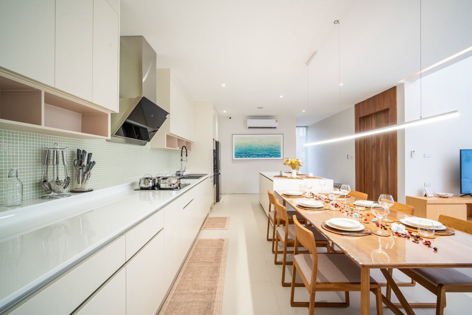 Fully equipped kitchen with island and long dining table