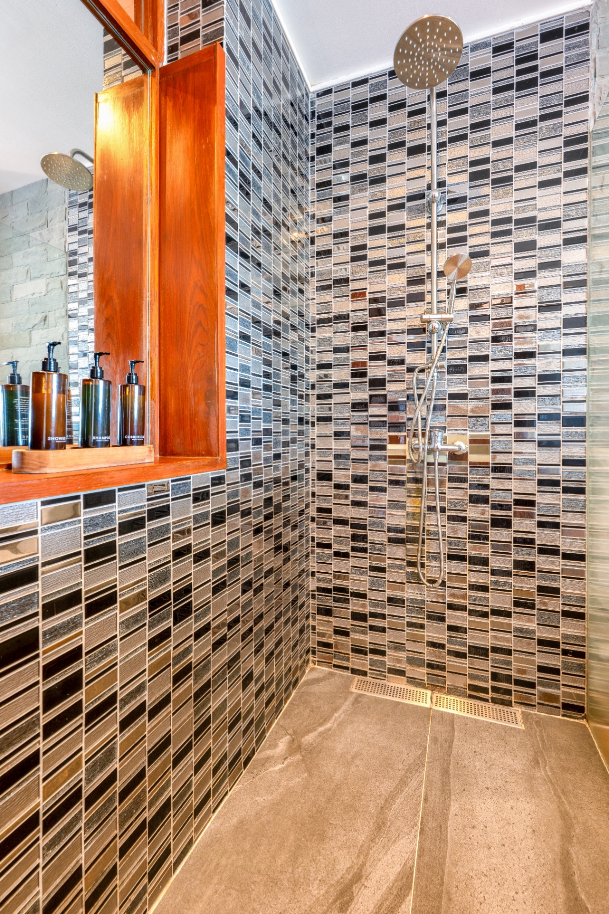 Walk-in rain shower with mosaic glass tiling