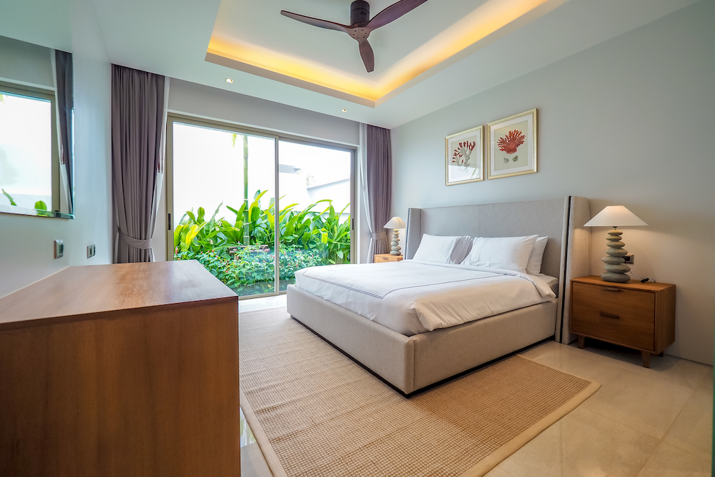 Second bedroom with garden view and elegant furnishings