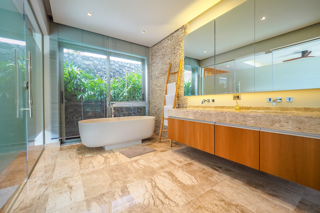 Master bathroom with double vanity and garden outlook