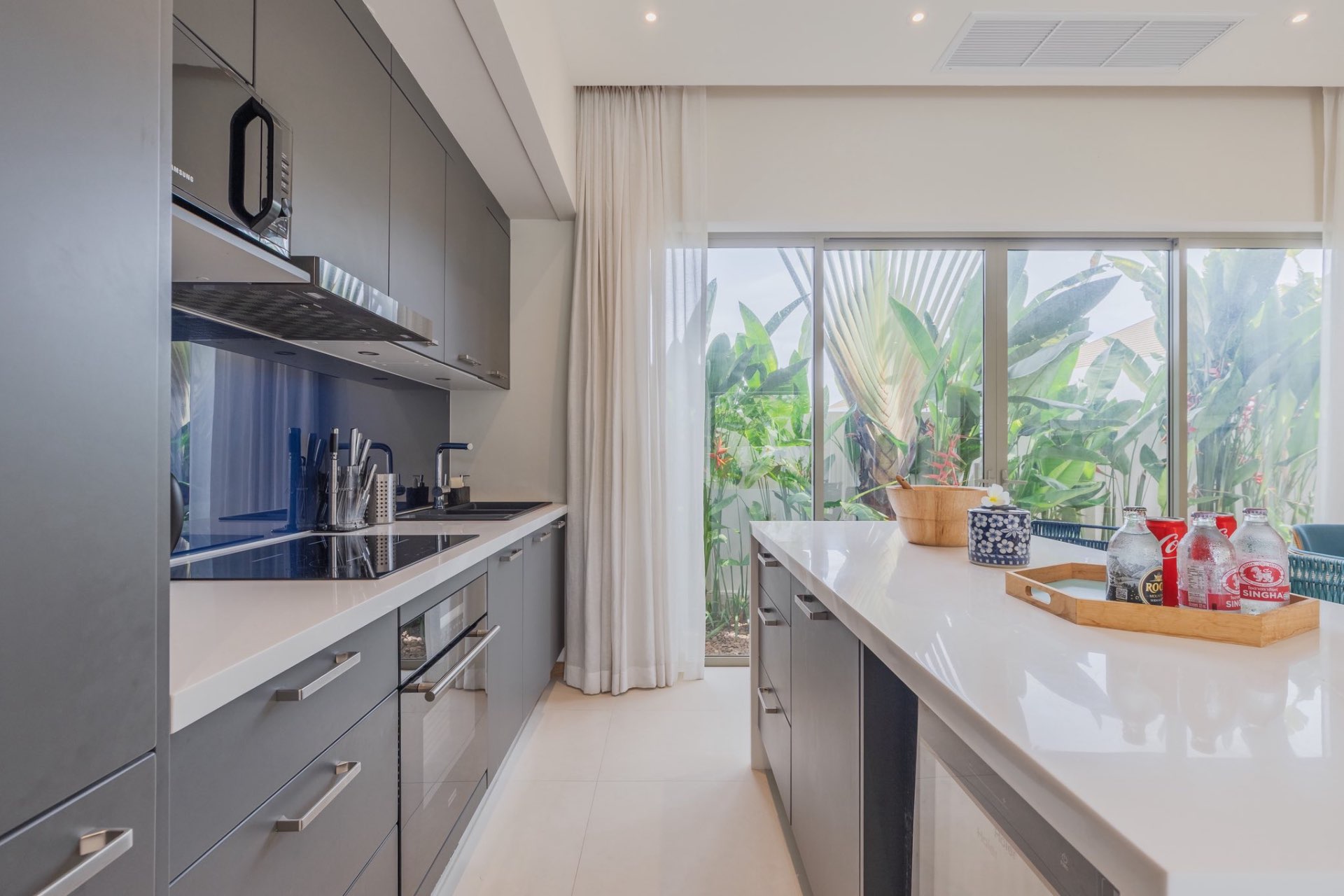 Western kitchen island with bar seating and garden window