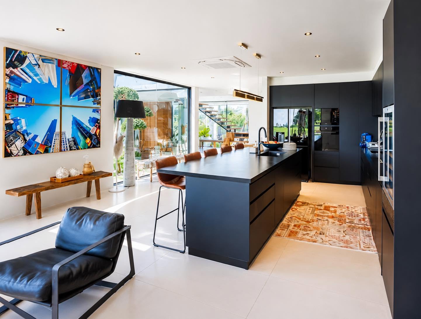 Matte black designer kitchen island with golf course view