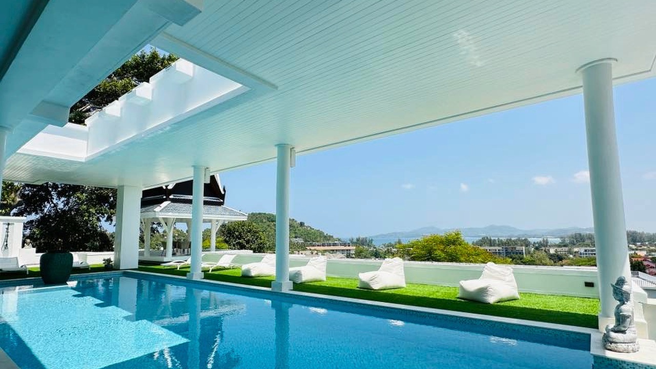 Pool terrace with bean bags and ocean view at Surin Hills villa