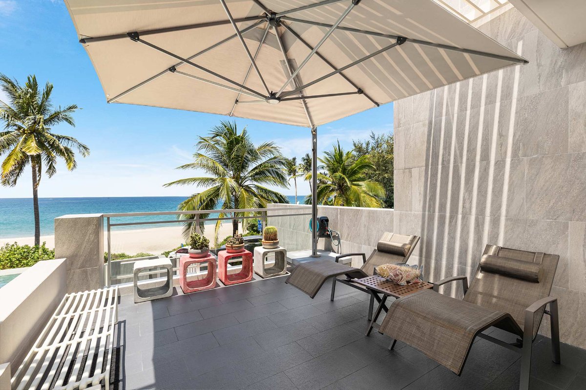 Private terrace with loungers and beach views