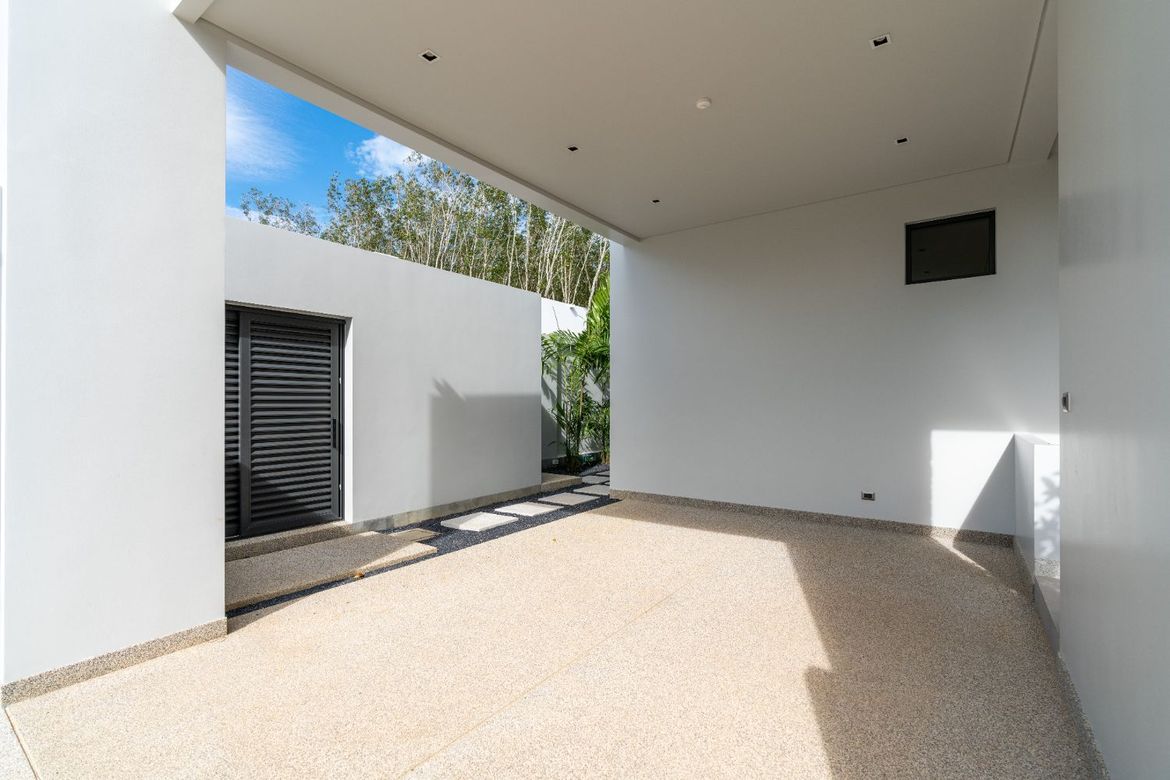 Covered carport and villa entrance