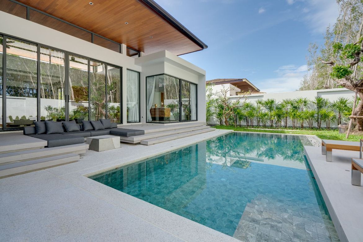 Private swimming pool with landscaped garden and loungers