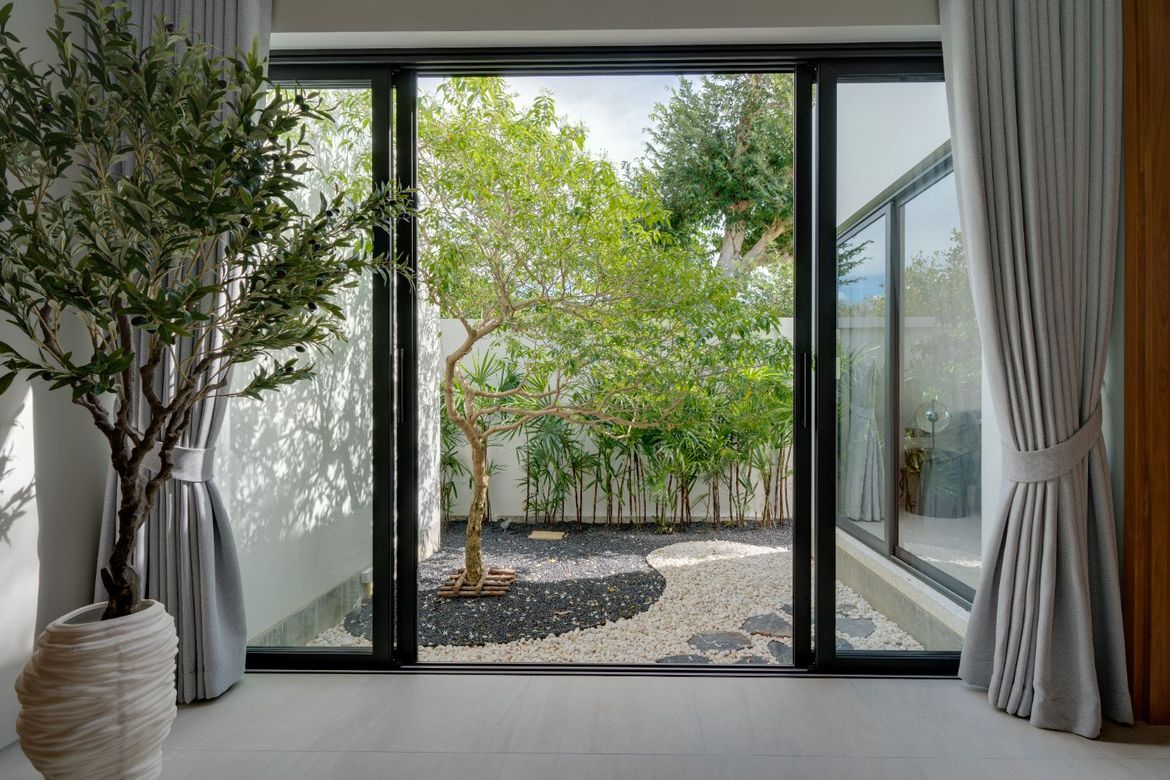 Private zen garden with tropical landscaping