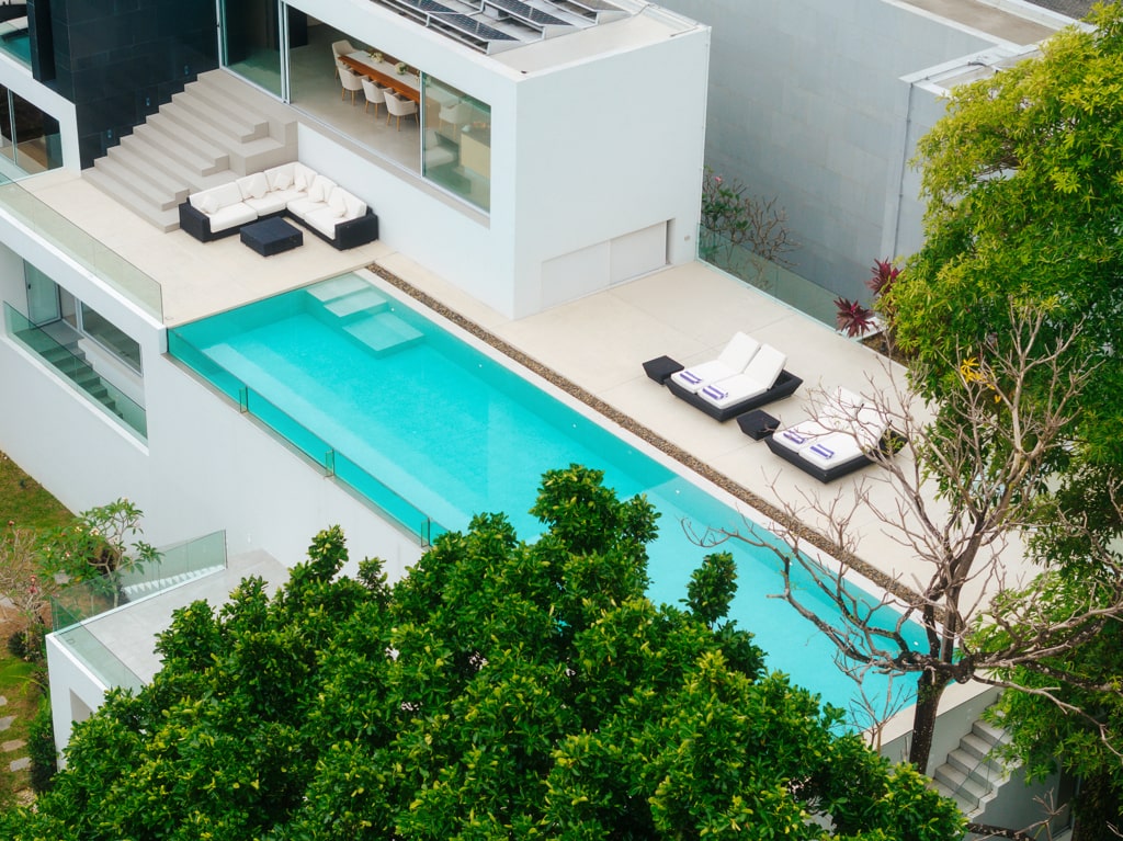Aerial view of cantilevered infinity pool over hillside