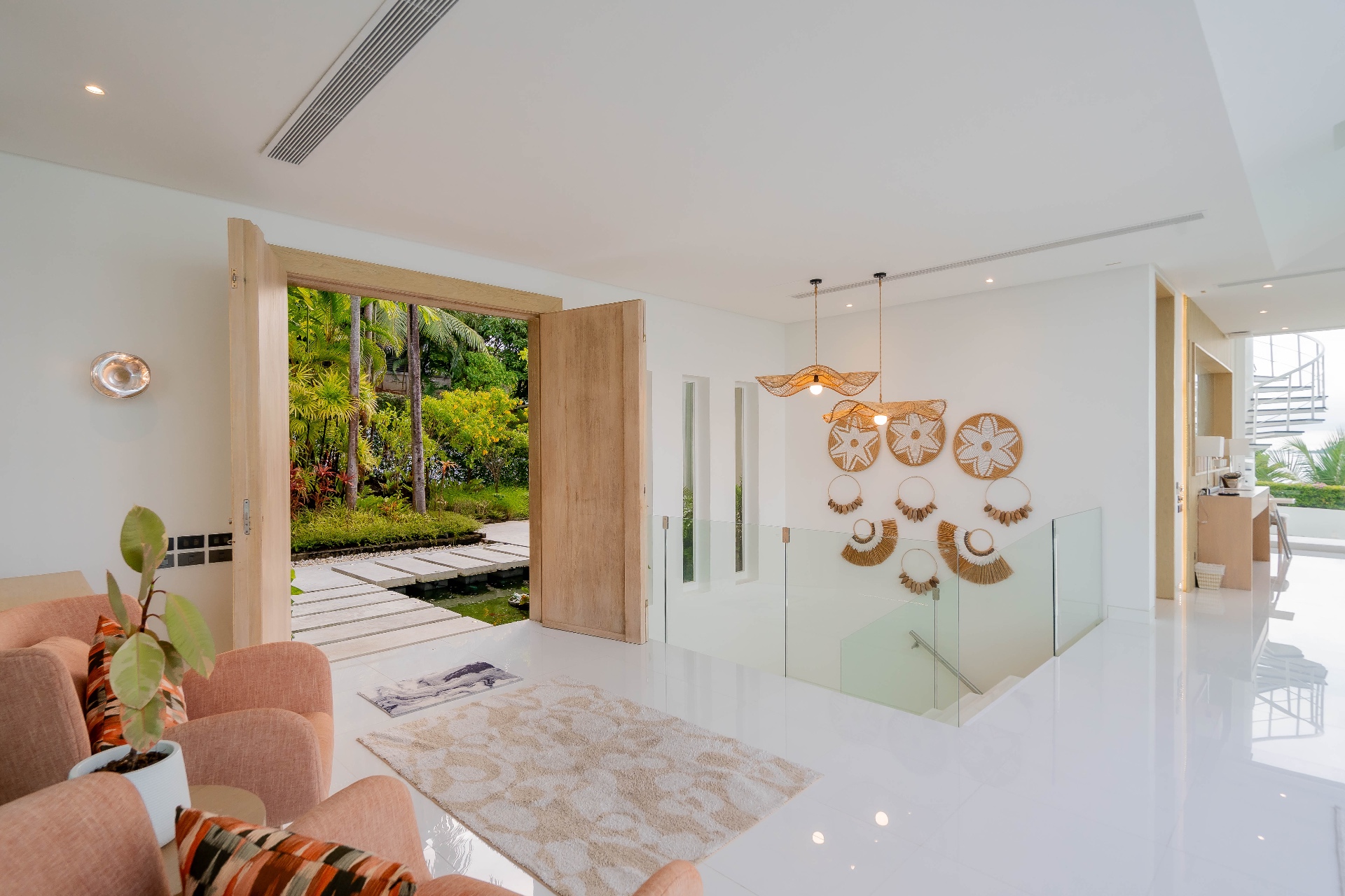 Grand entrance with tropical garden and koi pond