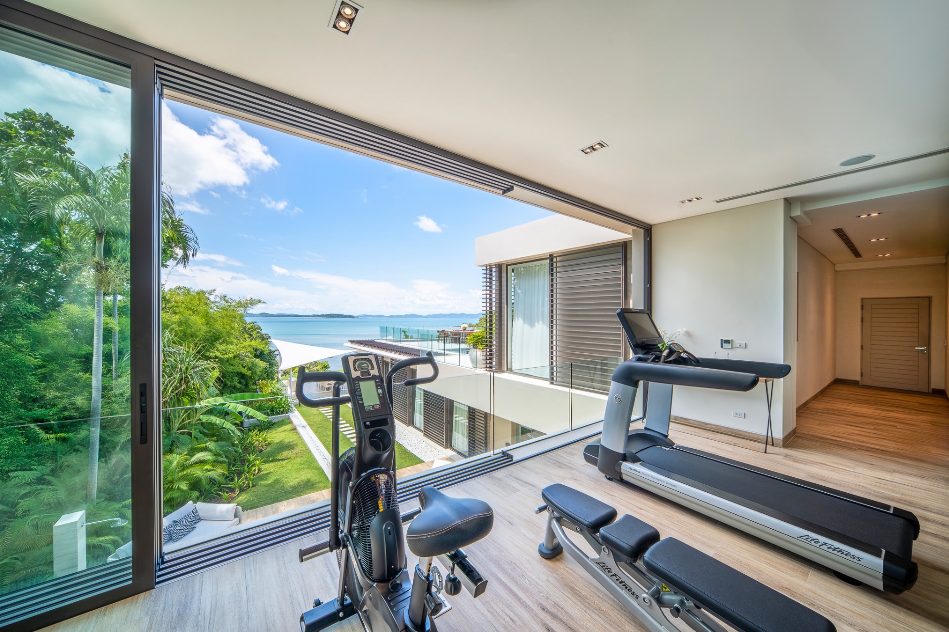 Private gym with sea view and fitness equipment