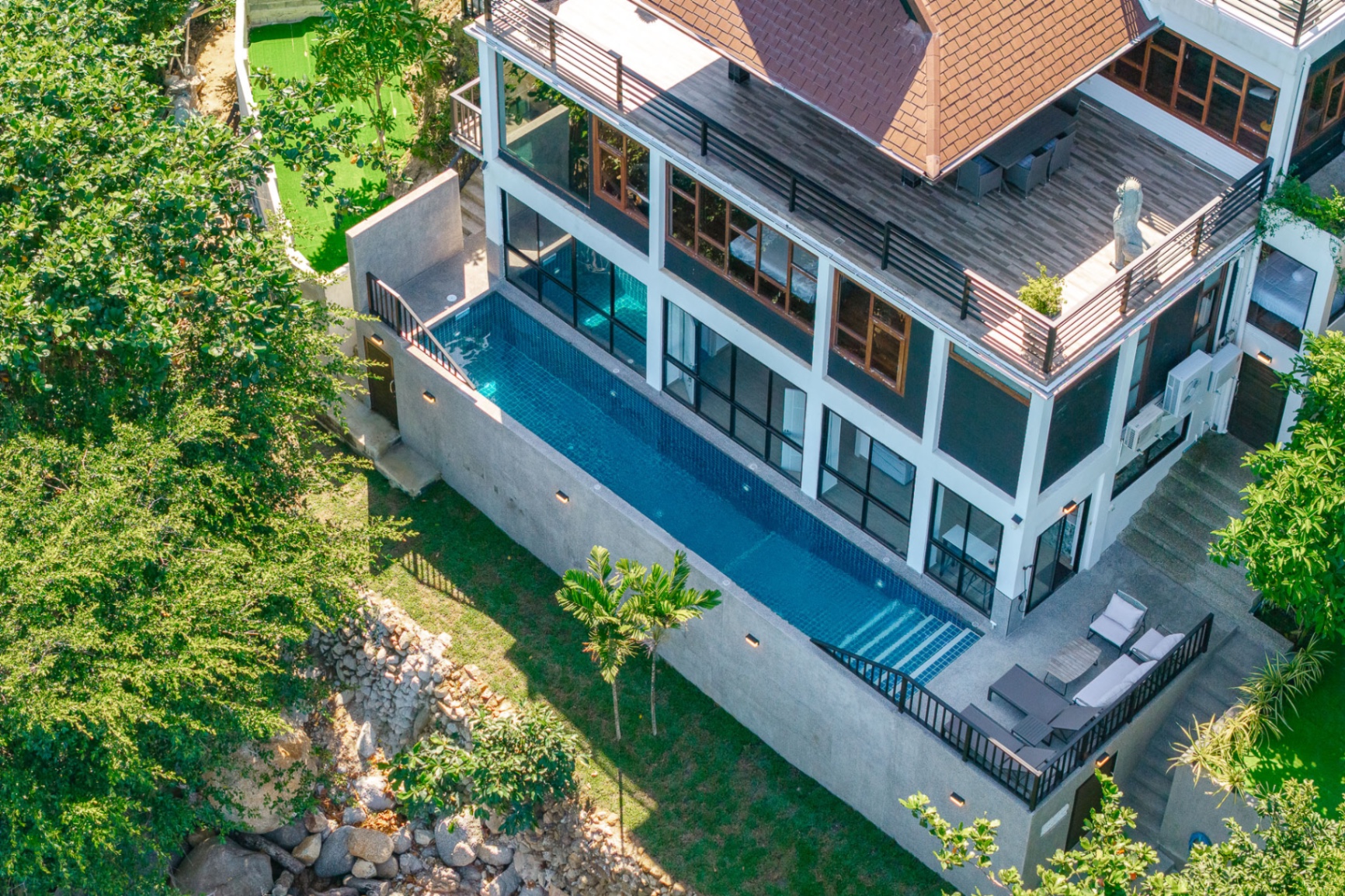 Aerial view of the oceanfront villa, pool and garden