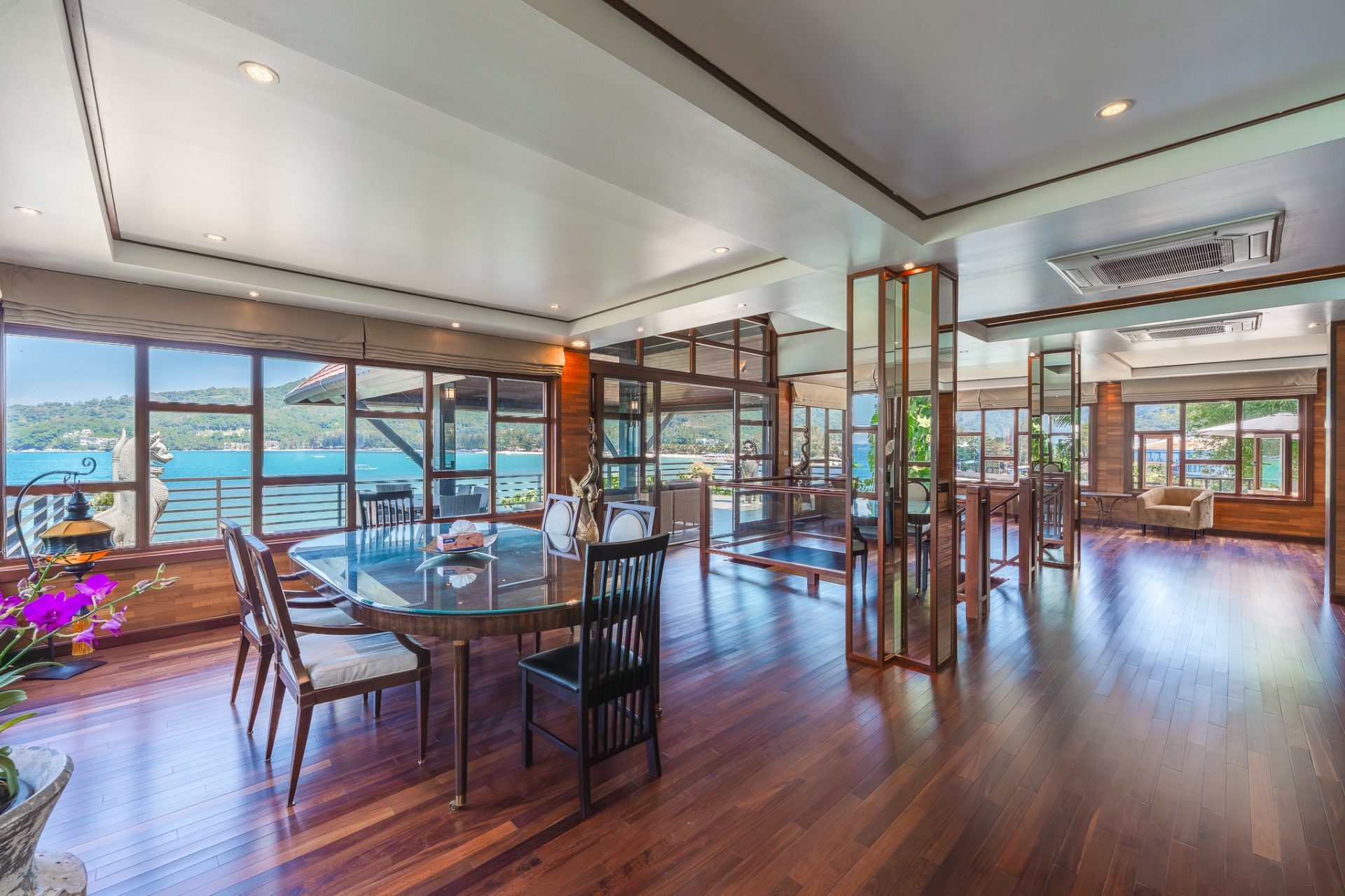 Dining and living area with panoramic bay views