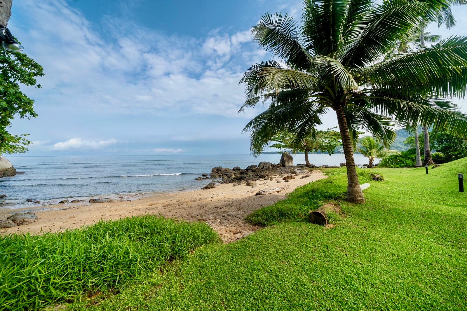 Private beach with palm trees and ocean views