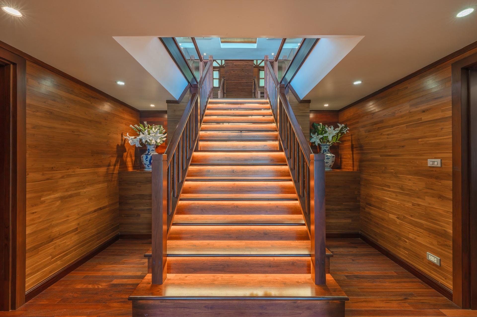 Grand teak wood staircase with LED lighting