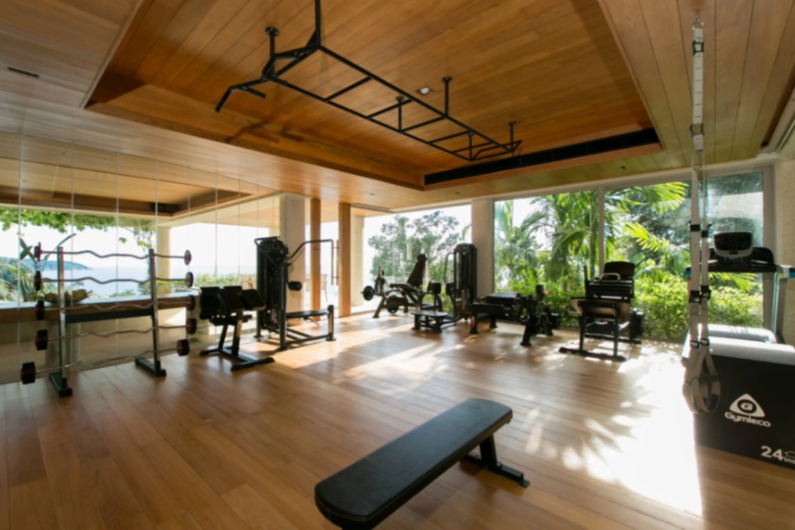 Wide-angle view of the private gym with tropical outlook