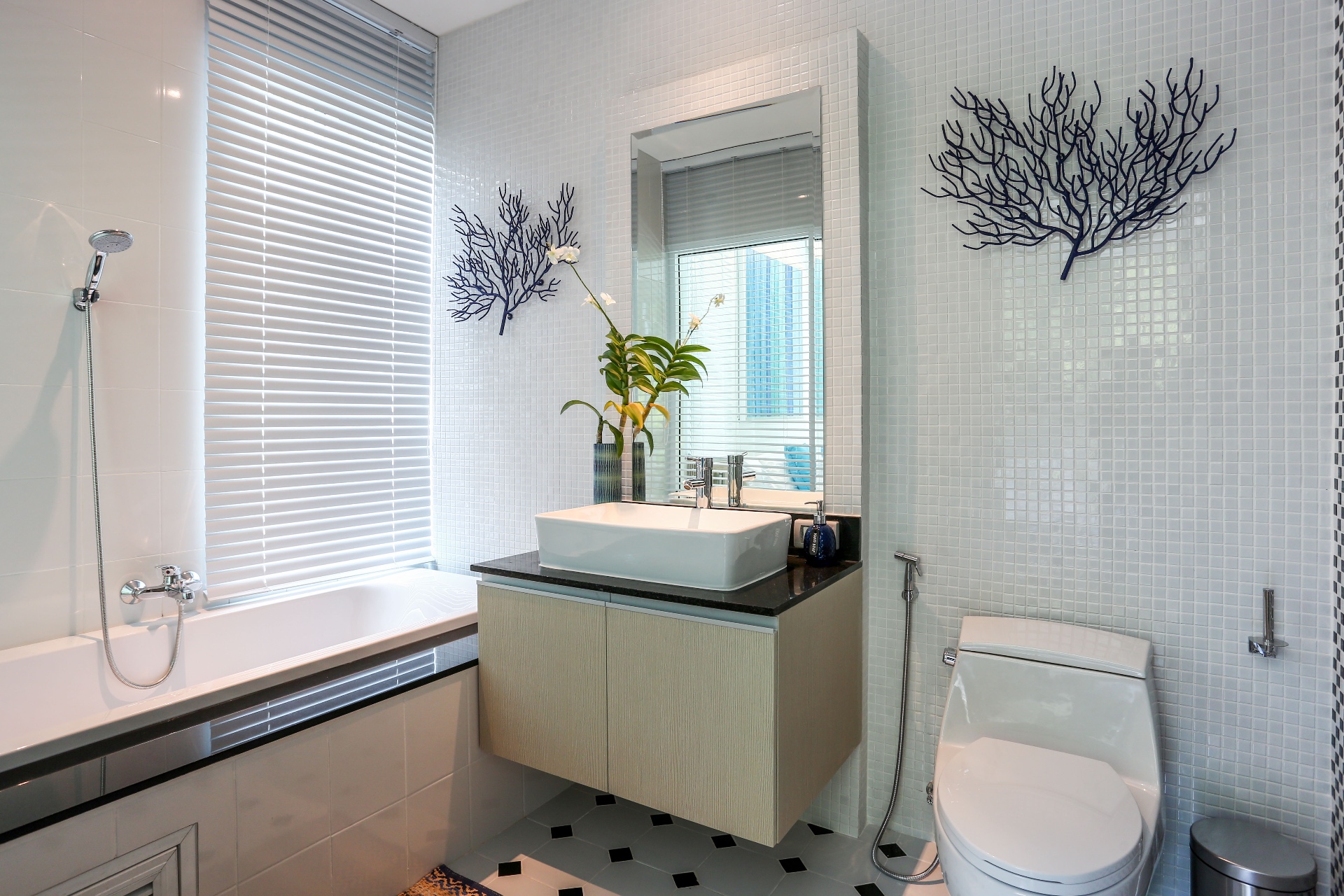 Bathroom with bathtub and coral wall decor