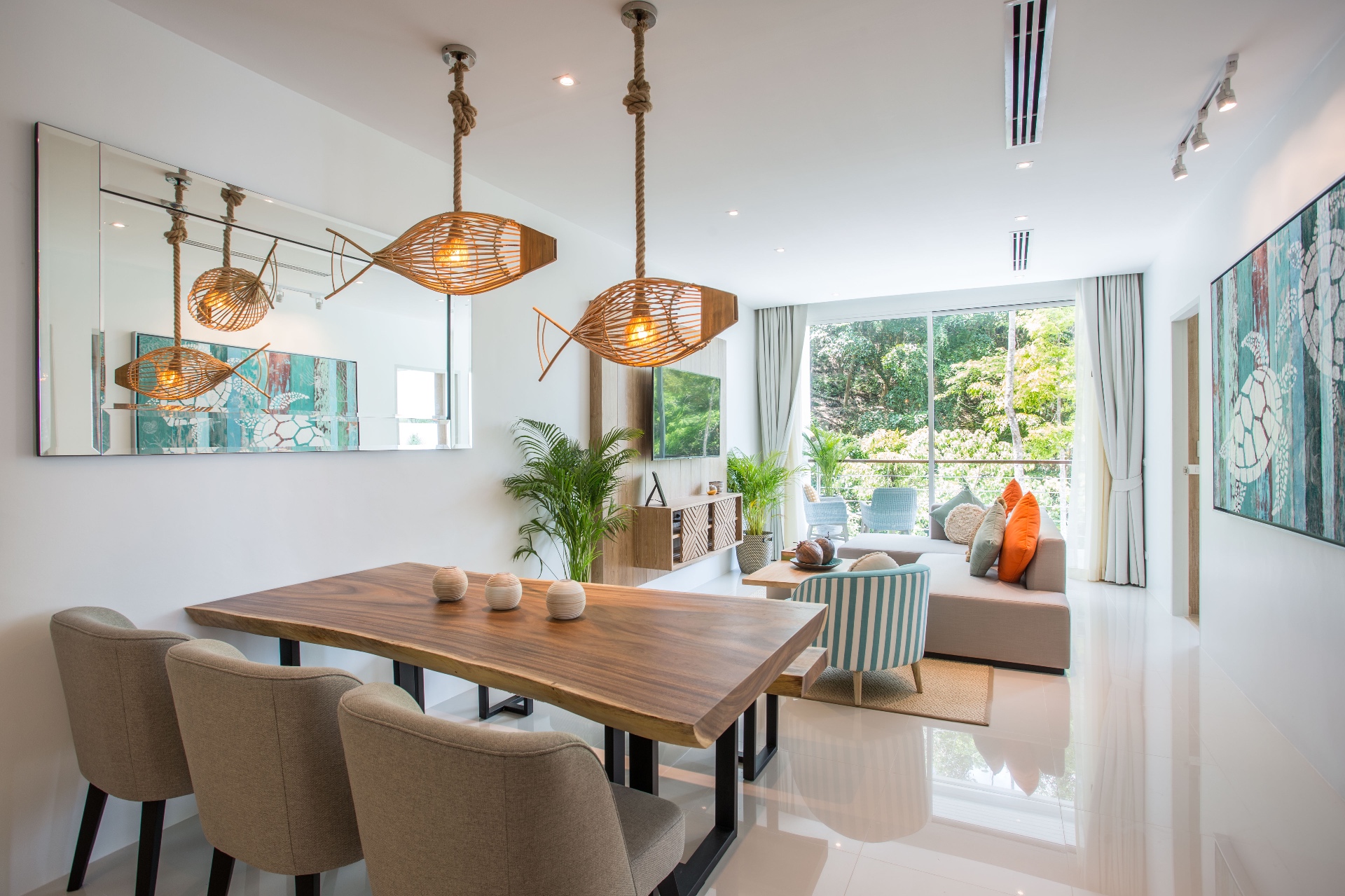 Dining and living area with fish pendant lights