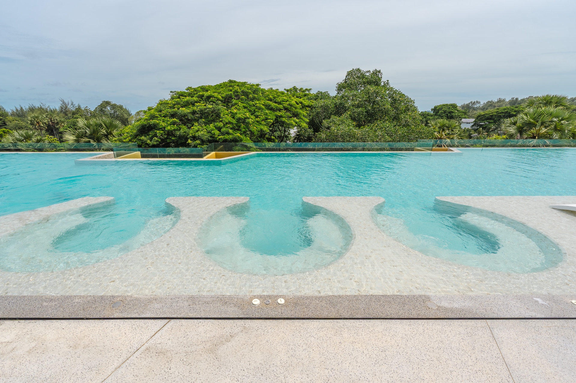 Pool with sunken stone loungers