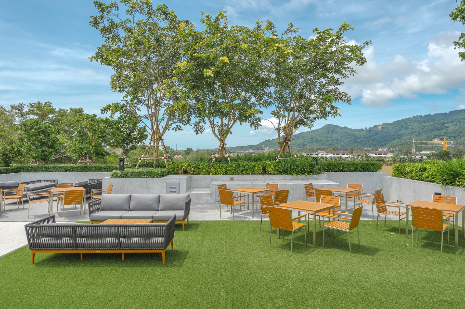 Rooftop terrace with outdoor lounge and mountain views