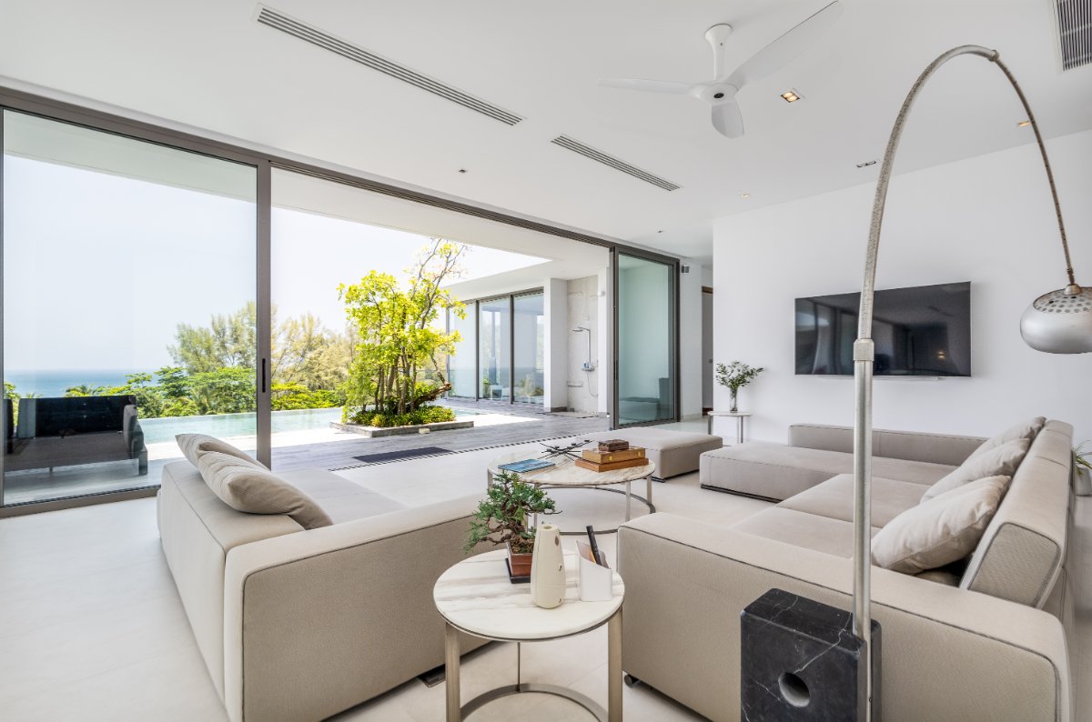 Contemporary living room with pool terrace views
