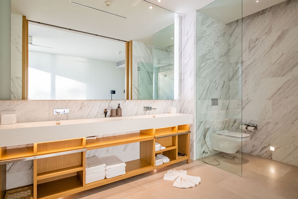 Marble bathroom with designer vanity and rain shower