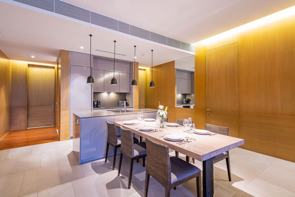 Kitchen and dining with warm wood panel accents